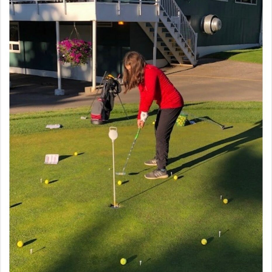student on putting green