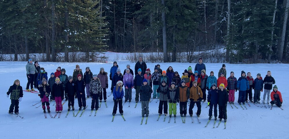 group of students cross country skiing