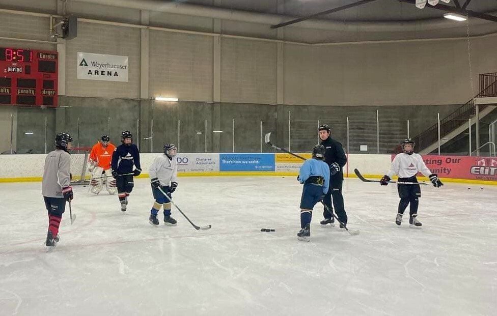 students playing ice hockey